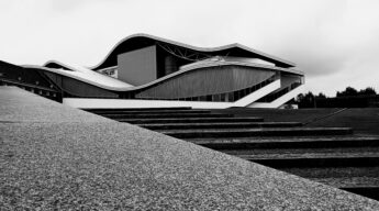 Stunning modern architecture featured in a black and white photograph, showcasing unique curves by Steffen through pexels.com