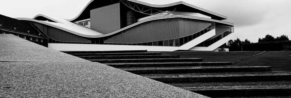 Stunning modern architecture featured in a black and white photograph, showcasing unique curves by Steffen through pexels.com