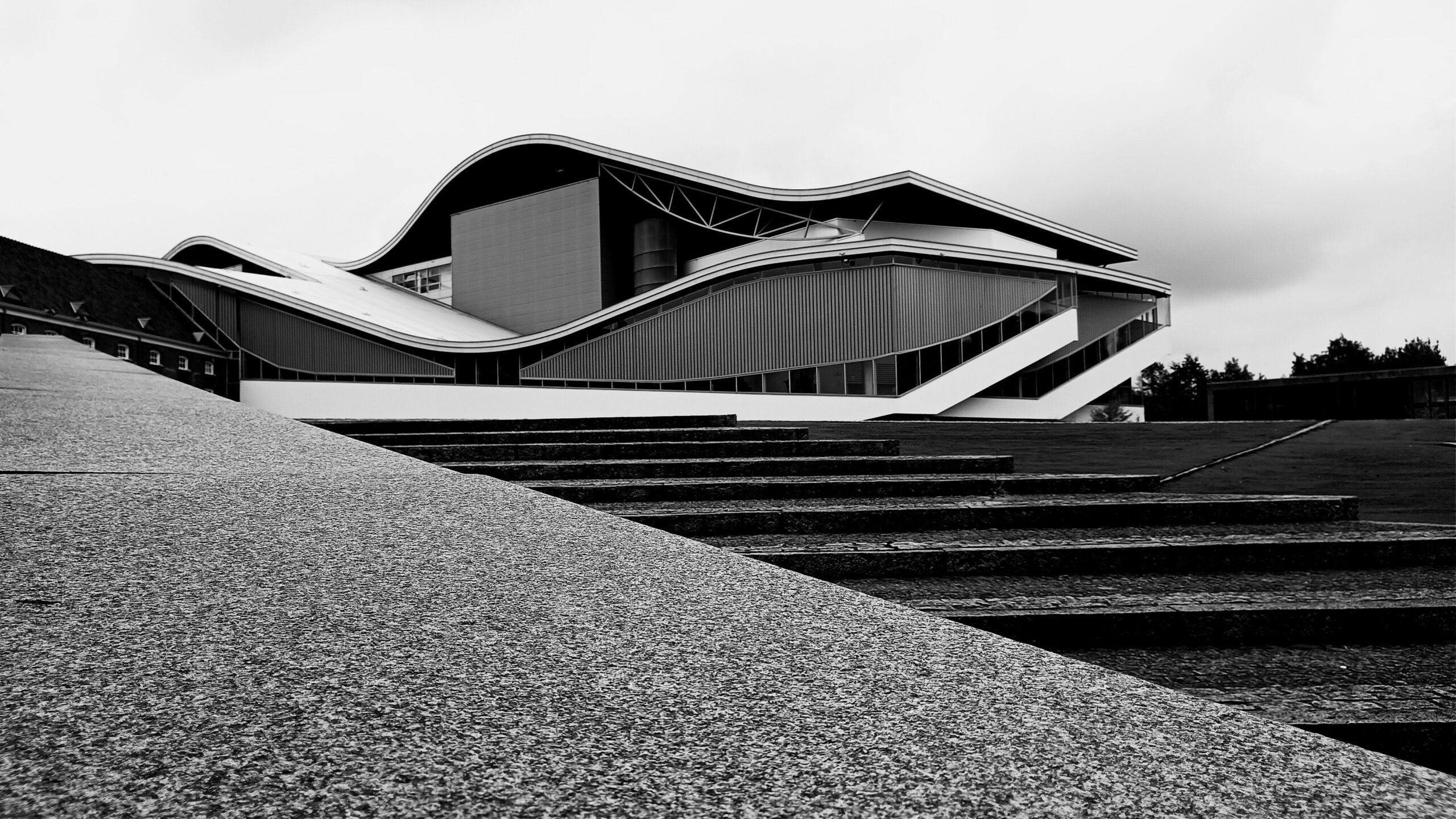 Stunning modern architecture featured in a black and white photograph, showcasing unique curves by Steffen through pexels.com